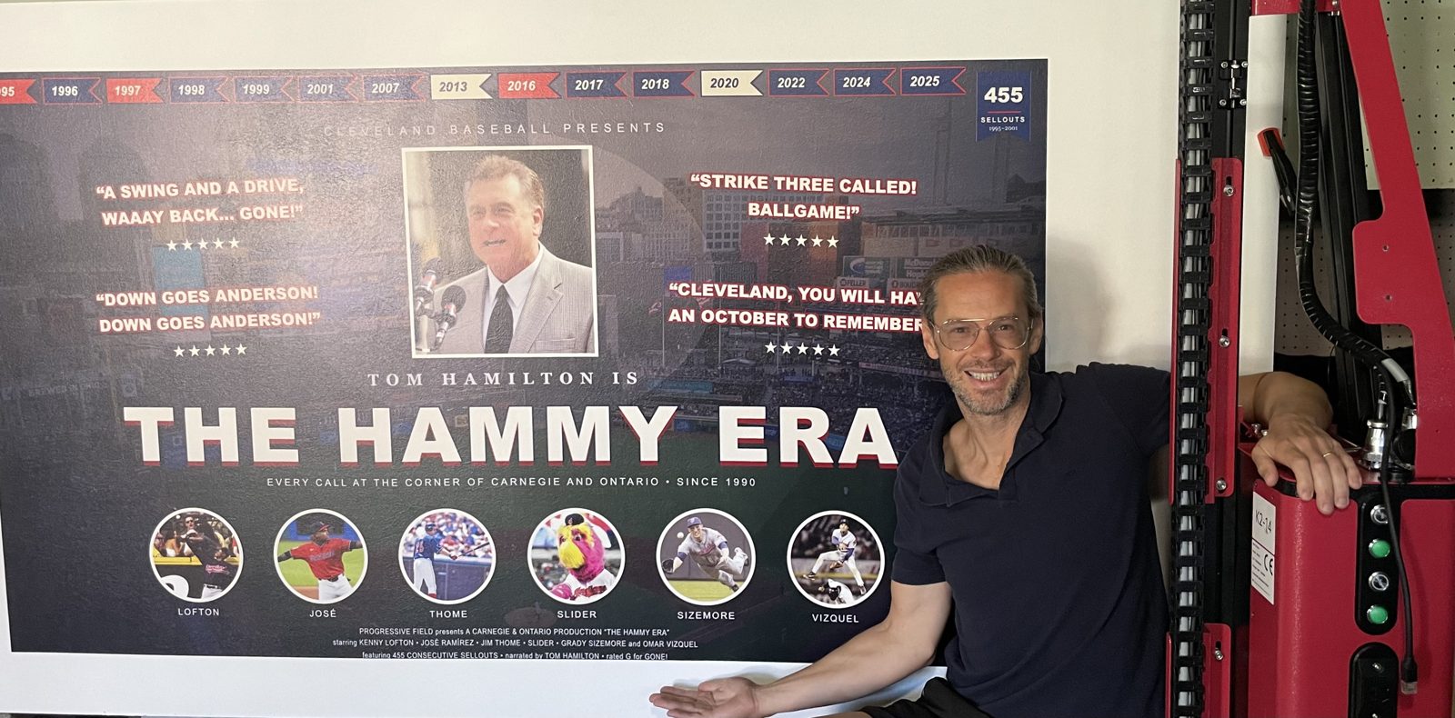 Marquee Murals founder with the six-foot Hammy Era print and the wall printing machine